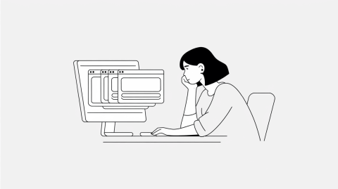 A woman from a construction company sits at her desk, looking wearily at her computer with many browser tabs open, browsing the tender portals